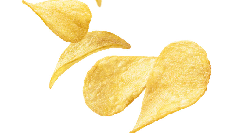 Potato chips floating in the air