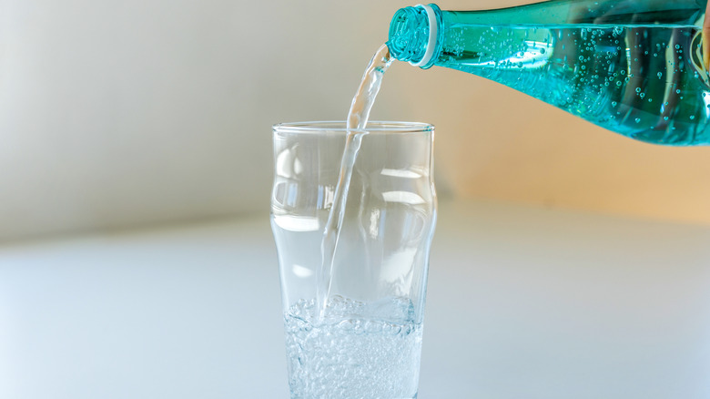pouring a glass of sparkling water