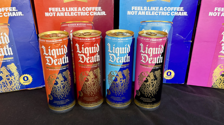 Liquid Death energy drinks in front of boxes