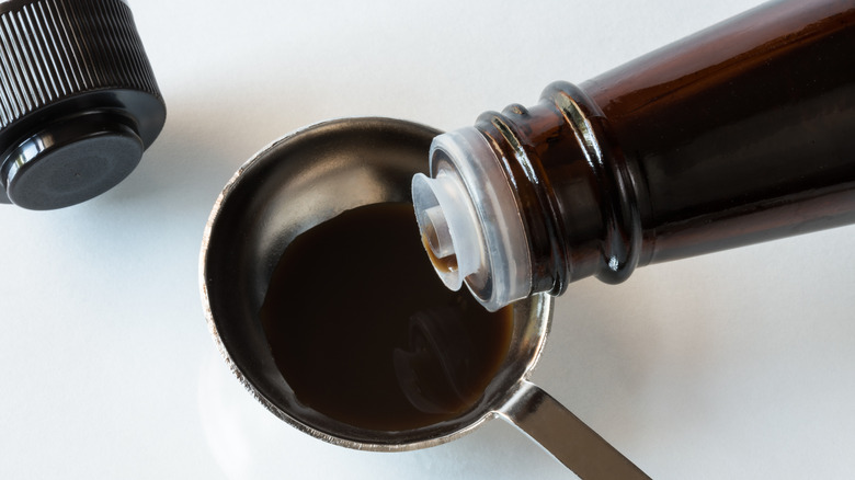 Pouring Worcestershire Sauce in a Teaspoon