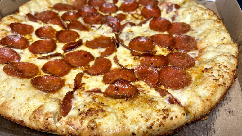 Close up of Little Caesars pepperoni pizza with stuffed crunch crust