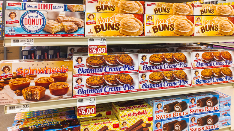 Boxes of Little Debbie snacks on grocery store shelf