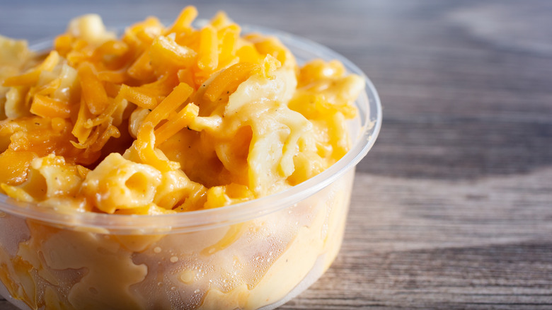 A plastic container of mac and cheese