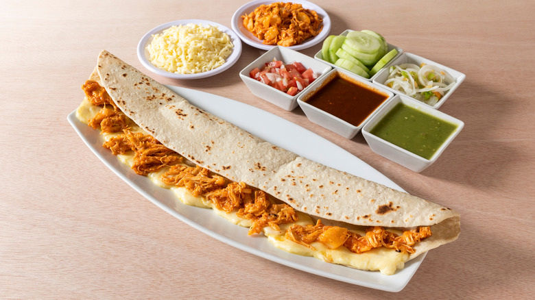 A machete quesadilla with various accompaniments