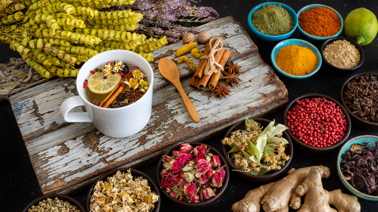 tea mug with spices floating in it