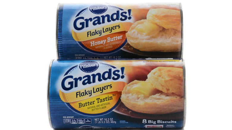 Two cans of Pillsbury biscuits against a white background