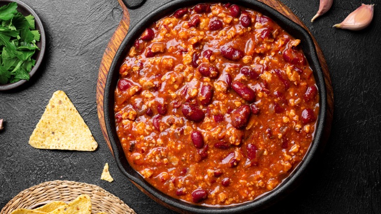 Ground meat and bean chili in cast iron skillet