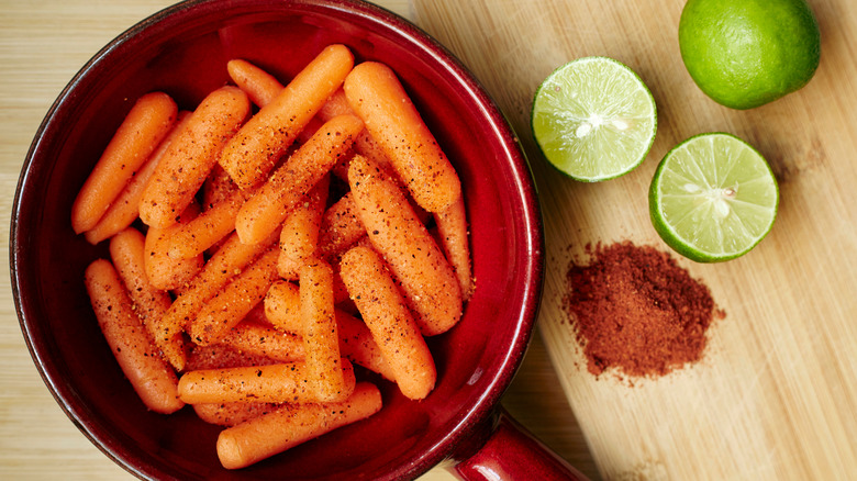 Raw baby carrots with fresh lime and chile powder