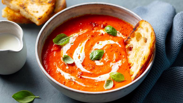 Bowl of tomato soup with toast