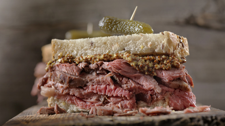 Roast beef sandwich topped with pickles