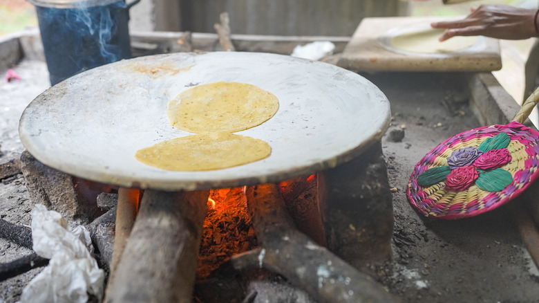 Tortillas on outdoor comal