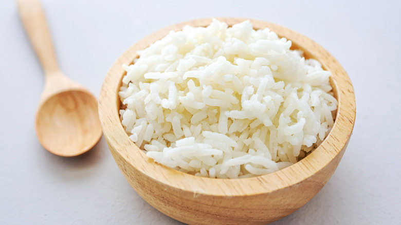 Steamed white rice in a wooden bowl