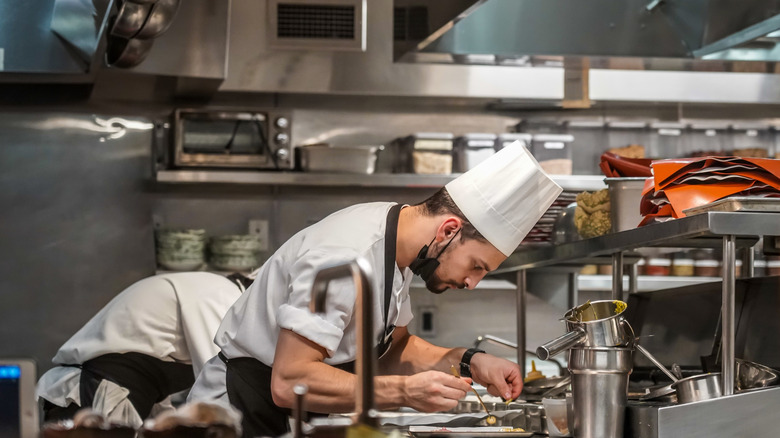 Plating dishes in a Michelin-starred kitchen