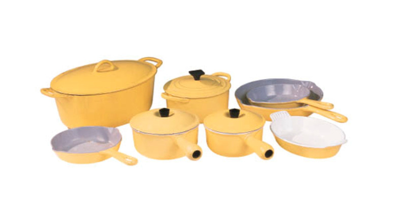 Elysée Yellow Le Creuset pots and pans owned by Marilyn Monroe on white background