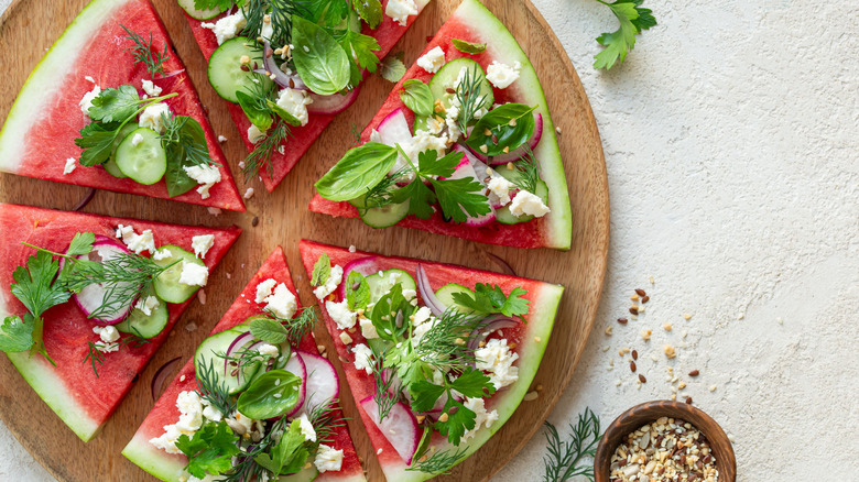 watermelon pizza with feta, cucumber, mint, and sliced radishes