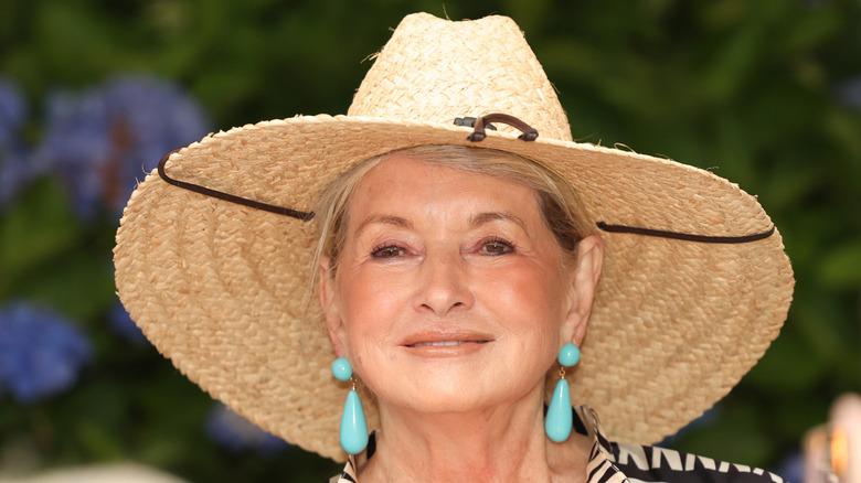 martha stewart smiling and wearing a hat