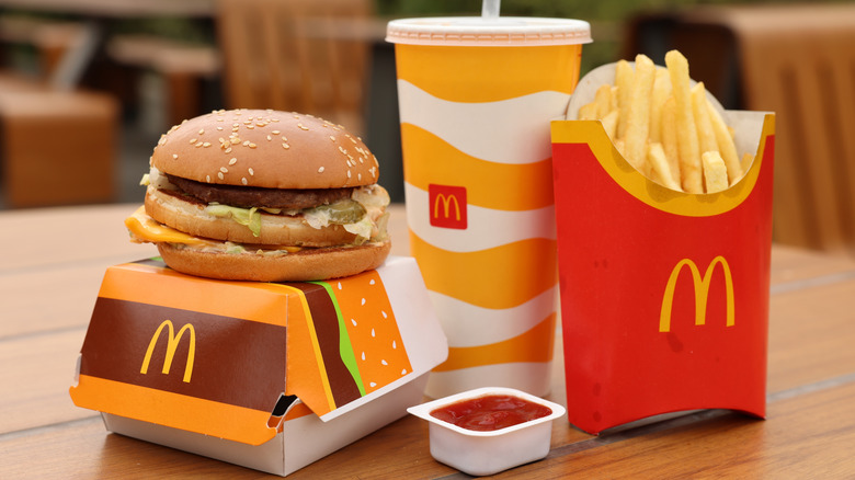 A Big Mac burger, fries, a drink, and side of ketchup from McDonald's