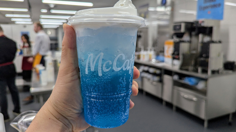 Hand holding McDonald's Sprite Berry Blast in McDonald's test kitchen.