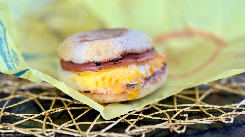 A McDonald's egg McMuffin on a wax paper wrapper