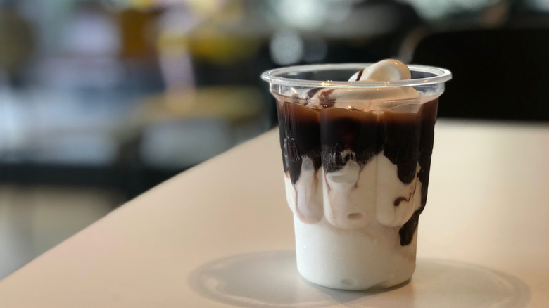 Mcdonald's chocolate ice cream on table in restaurant.