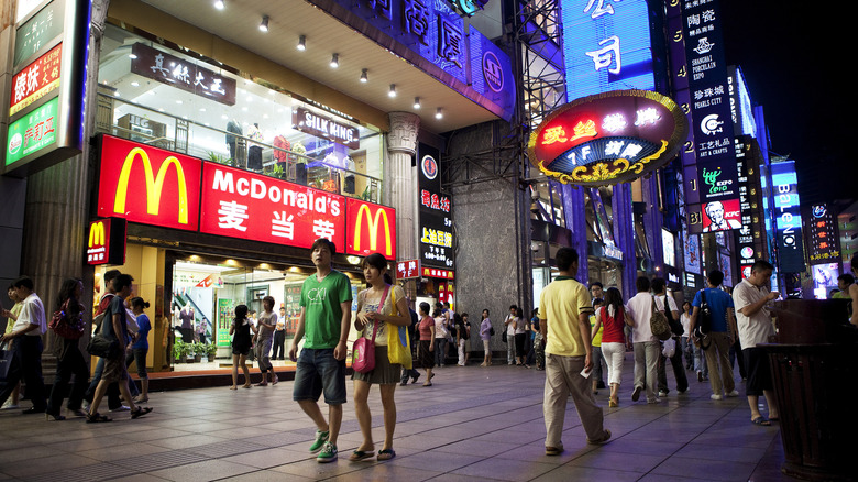 Shoppers walking in front of a McDonald's in Shanghai, China