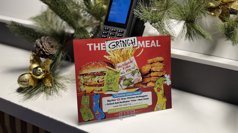 Sign for The Grinch Meal on white counter