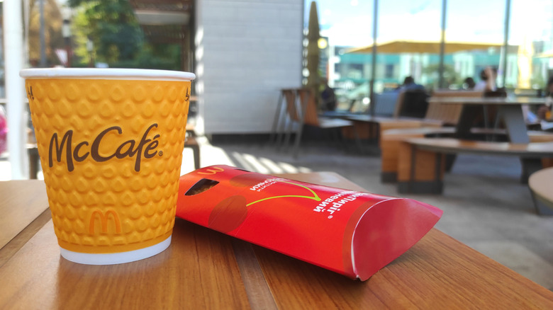 McDonald's pie and coffee on McDonald's table.