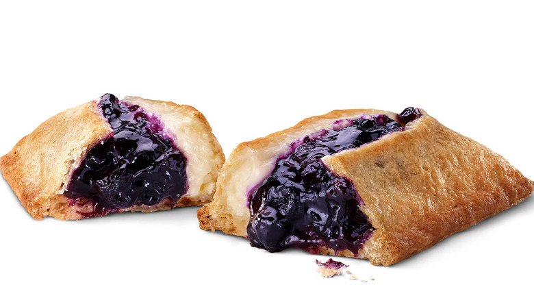 Blueberry and Crème Pie split in half on white background