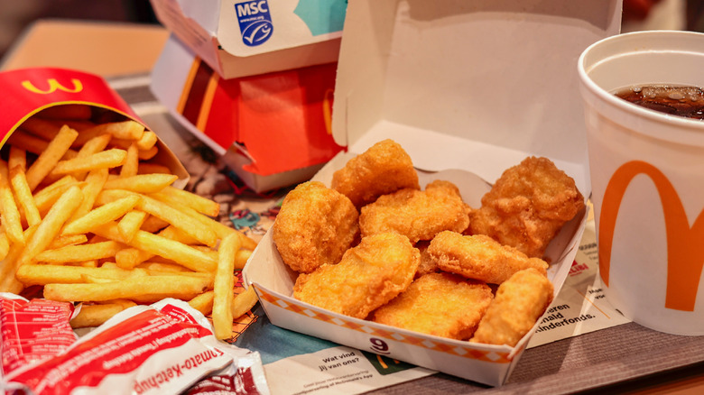 McDonald's Chicken McNugget meal on tray with fries and drink.