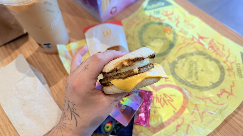 Holding Spice Sausage McMuffin