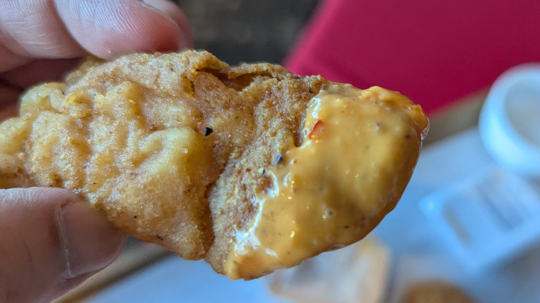McCrispy strip dipped in creamy chili dip