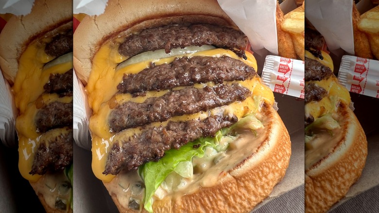 The 4x4 burger from In-N-Out with melty cheese and sauce dripping off of it