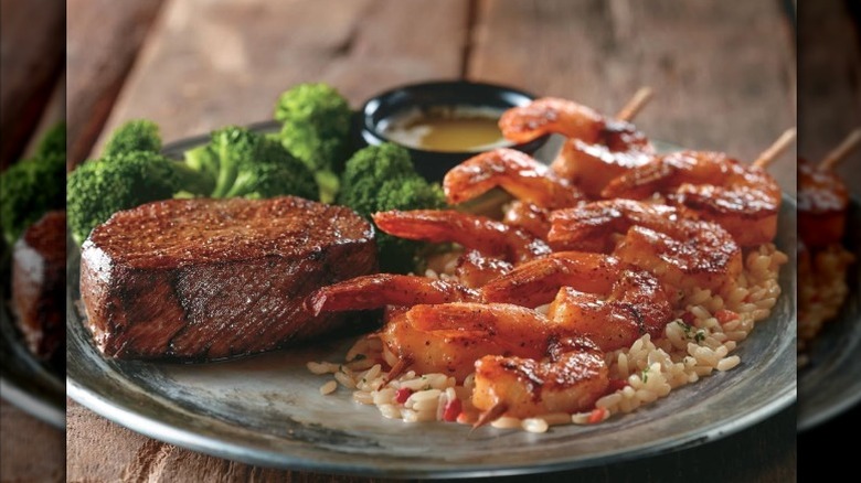 LongHorn's Renegade Sirloin served with shrimp, rice, and broccoli.