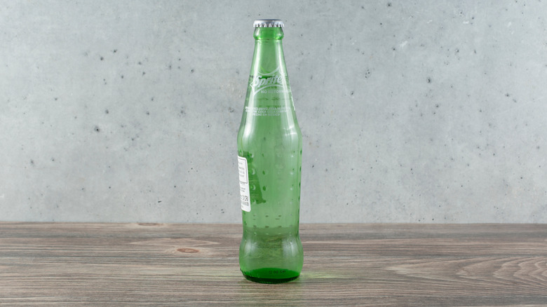 Green glass bottle of Sprite