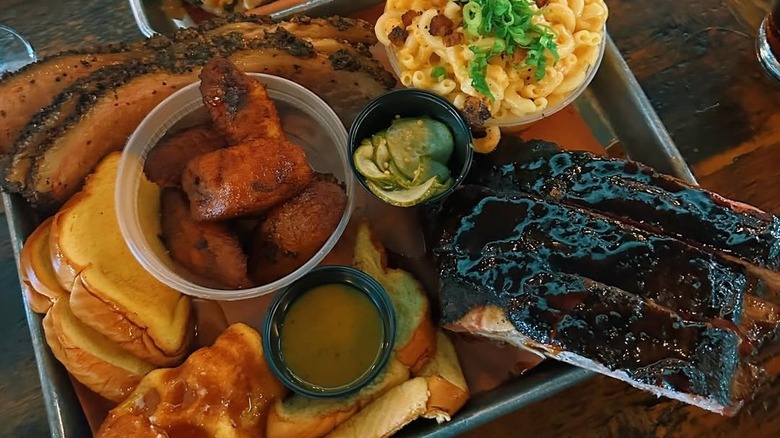 Multiple meats and side dishes at Apocalypse BBQ