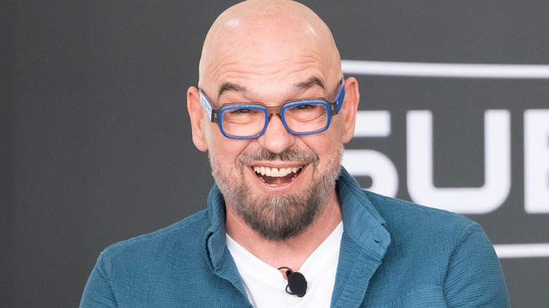 Chef Michael Symon smiling excitedly
