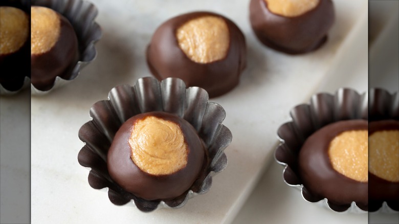 Smooth and Creamy Buckeye Chocolate and Peanut Butter Candies Chocolates on White Background