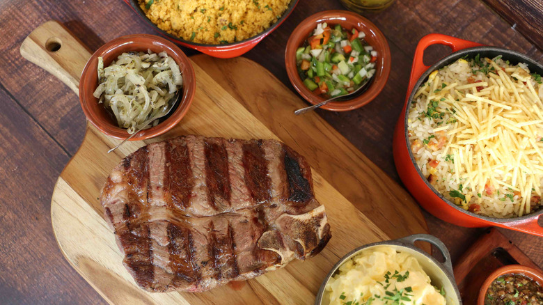 Short Rib or Rib Premium. Steak grilled in Argentine Parrilla with grill marks on a wooden board in the background