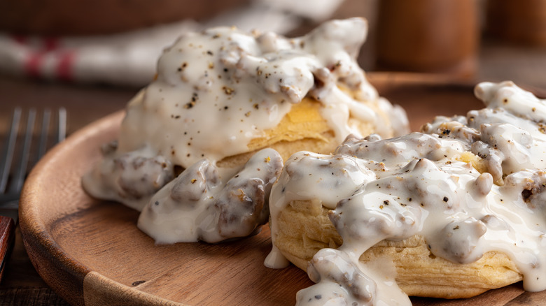 Piles of sausage gravy on biscuits