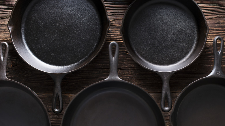 Cast iron skillets in row