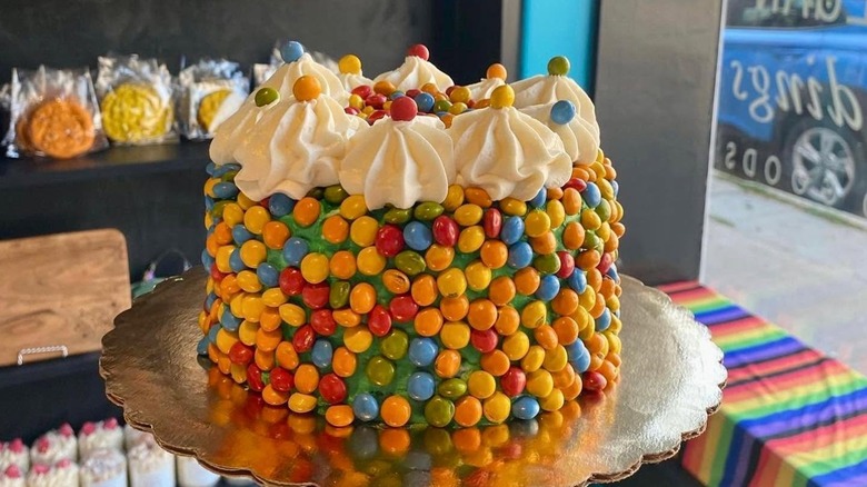 rainbow-colored Trupo Treats Earth Gems arranged on a cake as decoration