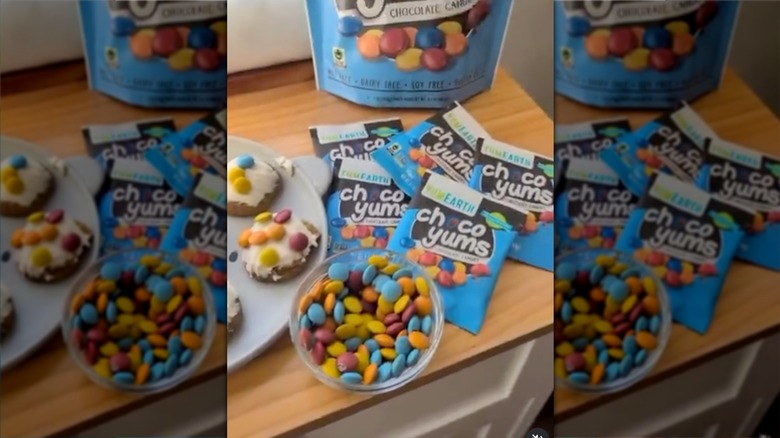 Bowl of YumEarth Choco Yums in front of packaging