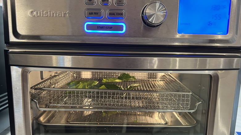 Cuisinart air fryer with greens cooking inside