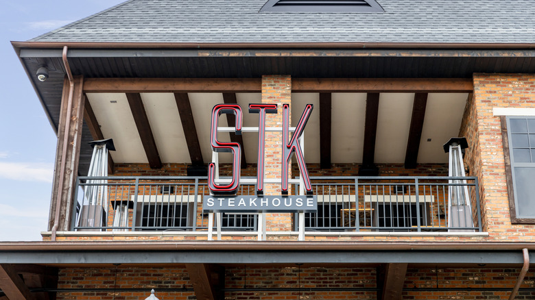 Exterior balcony of STK Steakhouse with sign