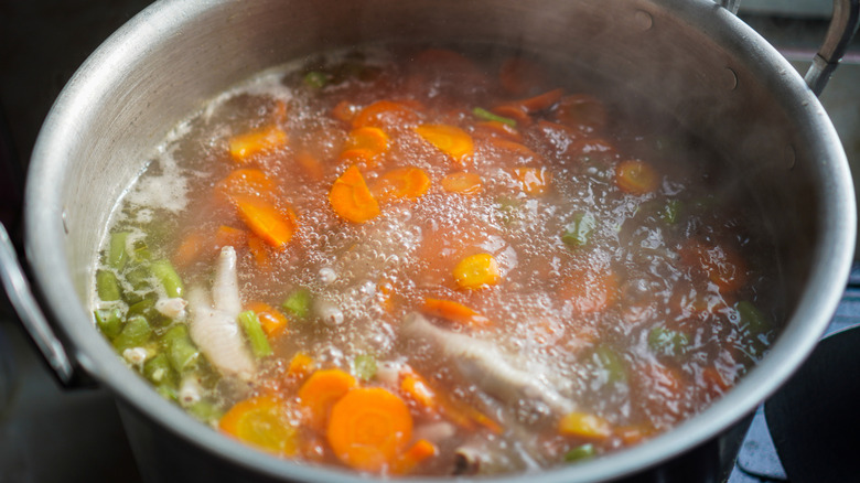 vegetables and broth cooking in a pot