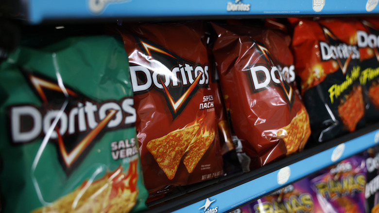 Various flavors of Doritos chips on a grocery store shelf