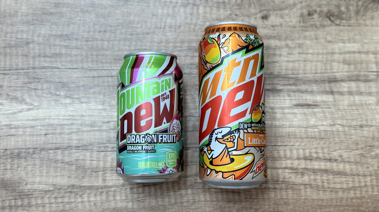 Two cans of different Mountain Dew varieties