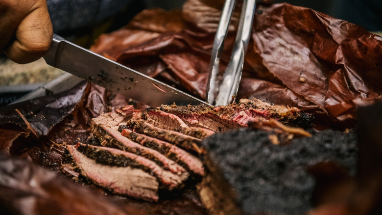 Sliced brisket on brown paper