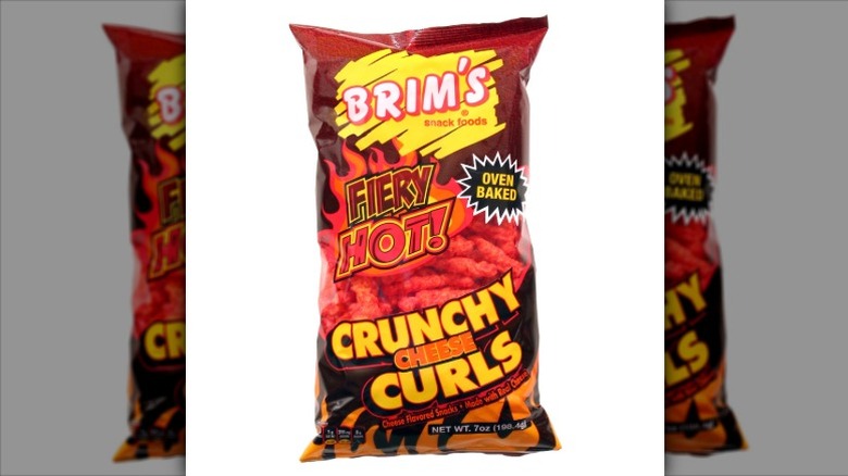 A bag of Brim's Fiery Hot Crunchy Cheese Curls on a white background.