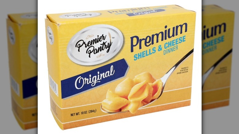 A box of Premier Pantry Original Premium Shells and Cheese on a white background.